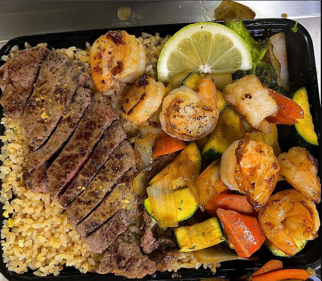 Hacienda Hibachi steak, shrimp, scallops and grilled vegetables over fried rice